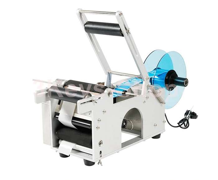 Automatic labeling machine for round bottles