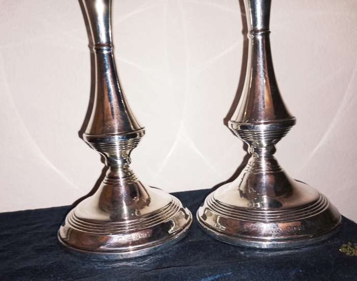 A lovely pair of silver candlesticks