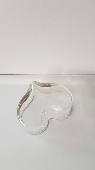 Heart shaped glass dish of thick glass.