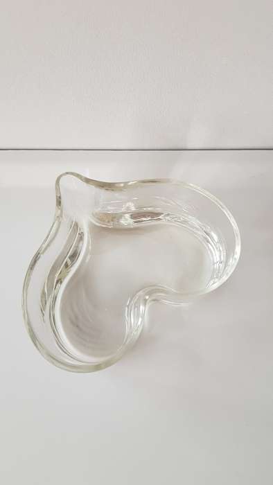 Heart shaped glass dish of thick glass.