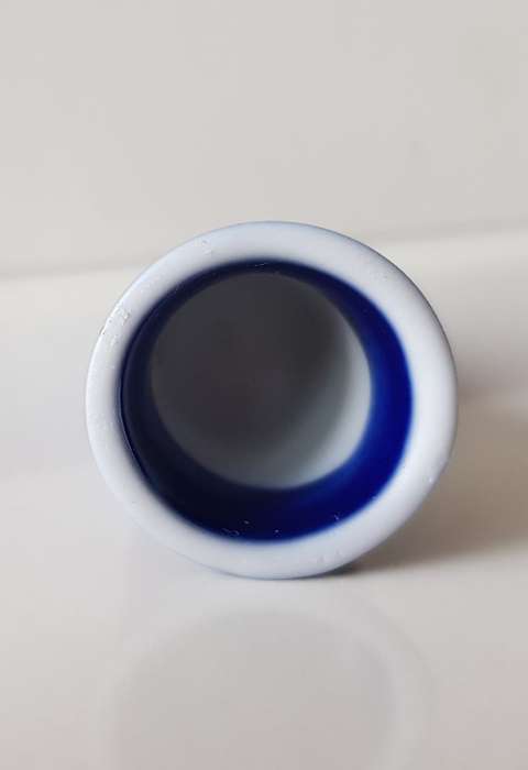 A Vintage collectors thimble. Thimble in blue glaze, painted flower in front
