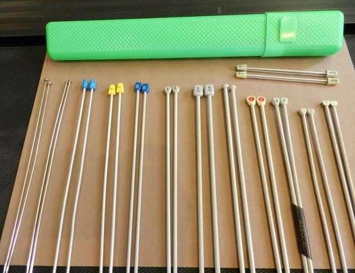 Vintage collection of knitting needles in holder. 12x Pairs of metal and aluminium (aero) knitting