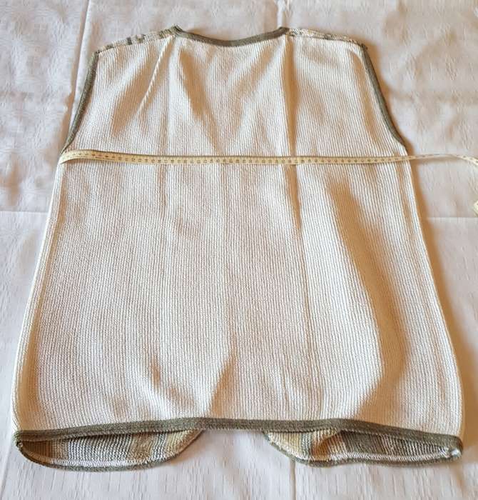 Ladies Sleeveless Cardigan  Cream background with beige/yellow and green pattern and four loop type