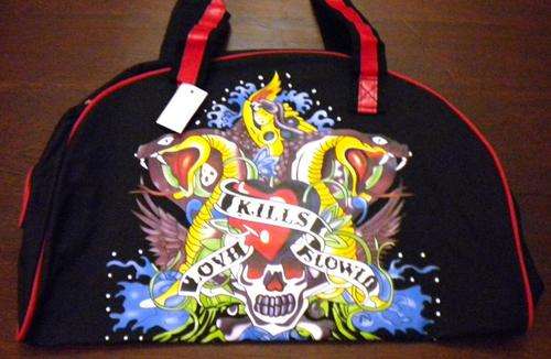Black  luggage bag with Ed Hardy design