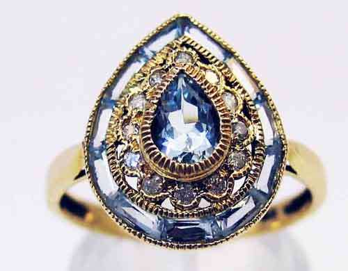 Genuine Aquamarines and Diamonds in 9K gold Ring.