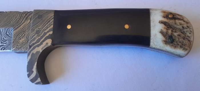 A Superb Damascus Blade Hunting Knife With Leather Sheath And Display Stand.