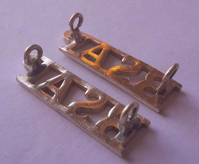 Pair Rhodesia BSAP (British South African Police) Shoulder Titles. Lugs intact.