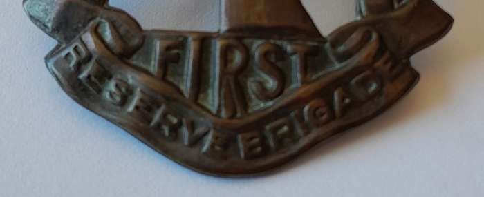 WW2 SA First Reserve Brigade Cap Badge. Bronzed Brass. Lugs Intact.