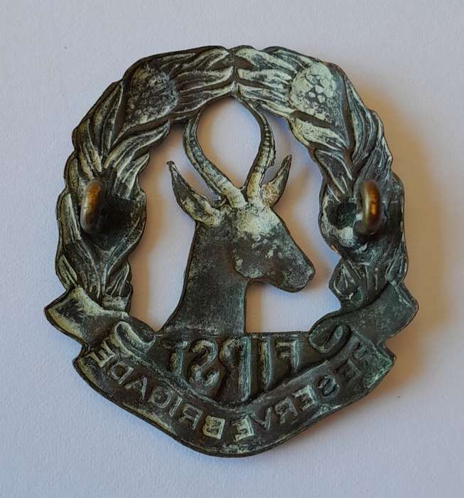 WW2 SA First Reserve Brigade Cap Badge. Bronzed Brass. Lugs Intact.