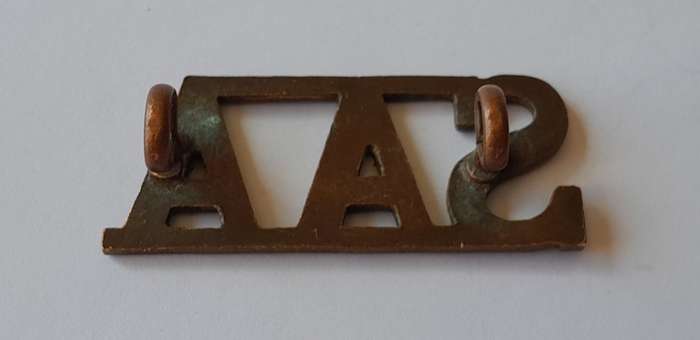South Africa Army Artillery Brass Title. Lugs Intact.
