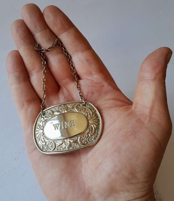 A Vintage Silver Plated `WINE` Bottle Decanter Label By `Ianthe, England`. (2 of 2)