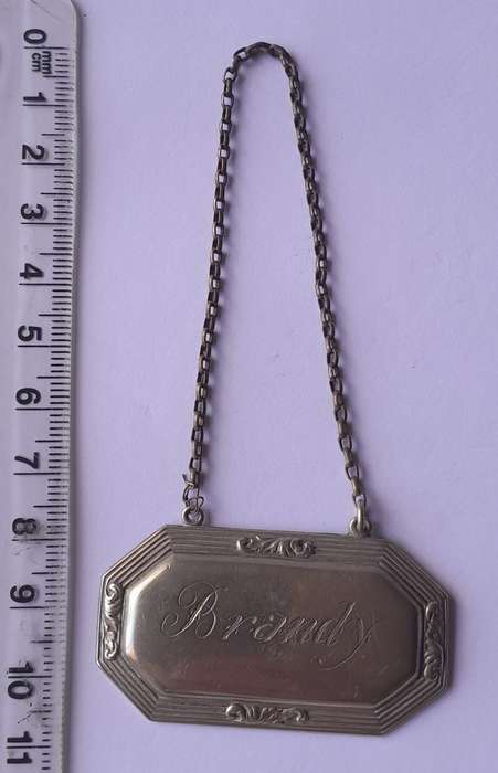 Vintage `Brandy` Decanter Label. Stamped `D&A`.