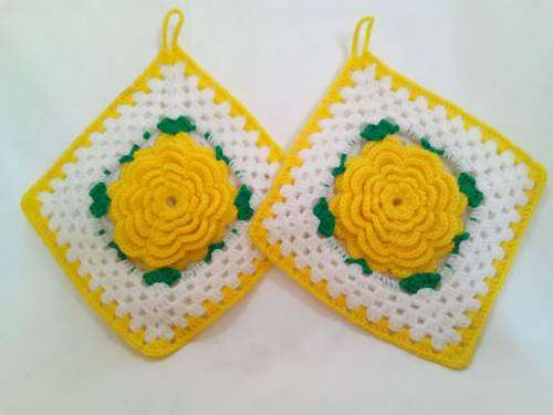 Nostalgia! Crocheted potholders with beautiful yellow flowers.
