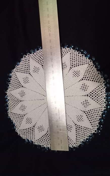 White Vintage crocheted jug cover with turquoise glass beads