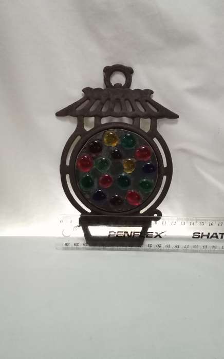 Vintage cast iron Trivet with glass  pebbles