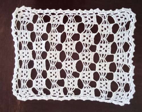 Very pretty crocheted tray cloth - 41cms across