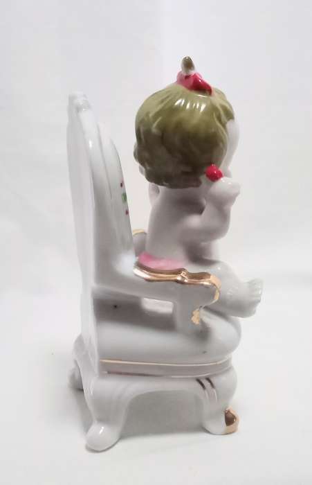 Most beautiful vintage brat! Crying baby on chair figurine