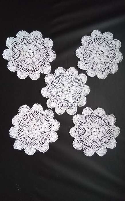 Five small Crocheted doilies - about 12cms across