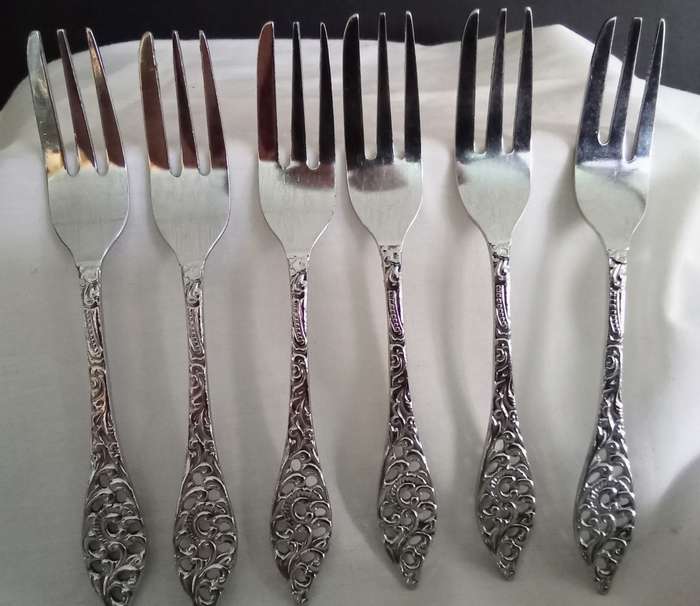Six vintage chrome plated cake forks