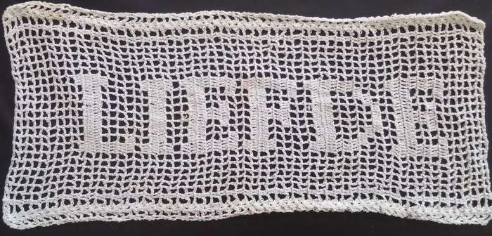 Notably unique white hand crocheted vintage doily
