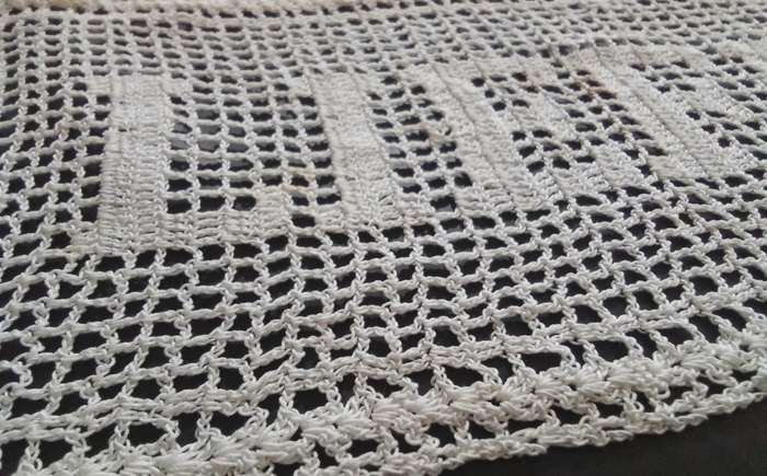 Notably unique white hand crocheted vintage doily