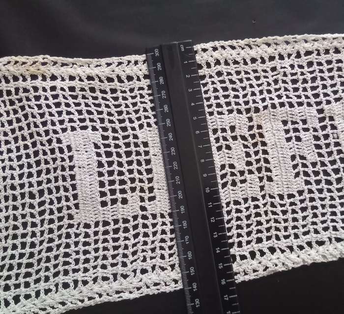 Notably unique white hand crocheted vintage doily