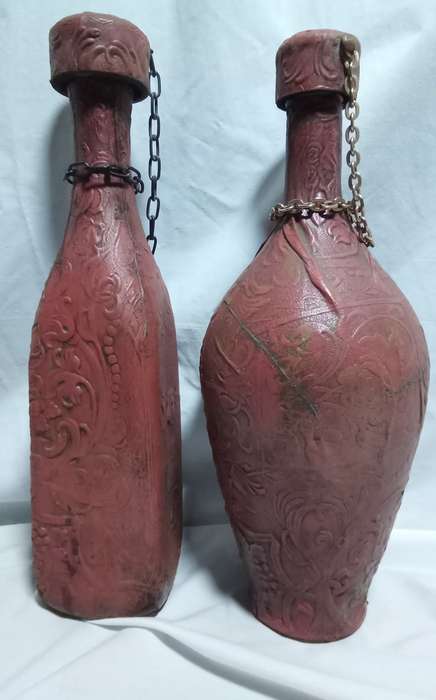 Two beautiful vintage leather clad wine bottles