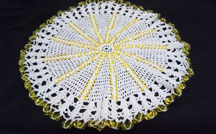 Beautiful beaded hand crocheted doily/jug cover - about 19cms across