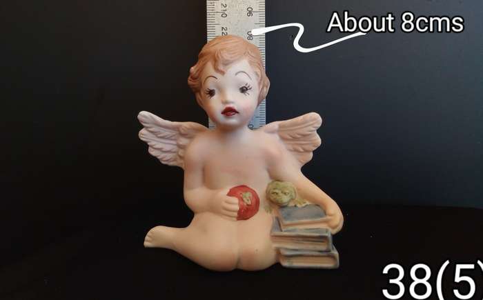 Beautiful  hand painted porcelain Angel with blue books