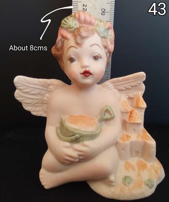 Beautiful  hand painted porcelain Angel with green beach bucket