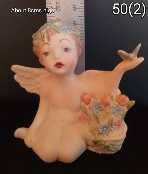 Beautiful hand painted porcelain Angel with butterfly