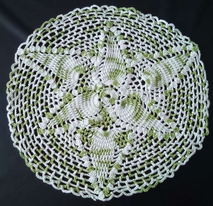 Beautiful white and green crocheted doily - about 30cms across