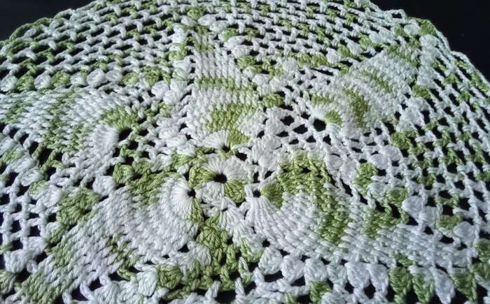 Beautiful white and green crocheted doily - about 30cms across