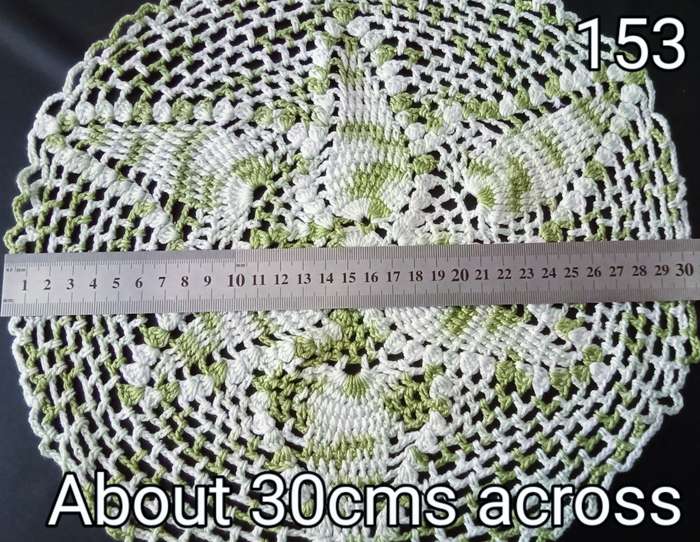 Beautiful white and green crocheted doily - about 30cms across