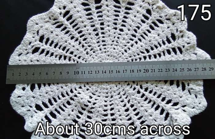 Lovely off-white crocheted doily - 30cms across