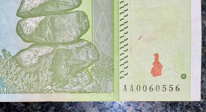 ZIMBABWE 10 TRILLION DOLLARS LOW NUMBER AA0060556 AUNC HARARE 2008 ZIM BIRD WTM