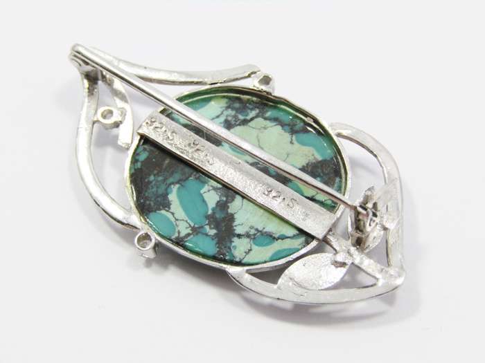 A Stunning Brooch With a Large Faux Turquois Stone in Sterling Silver.