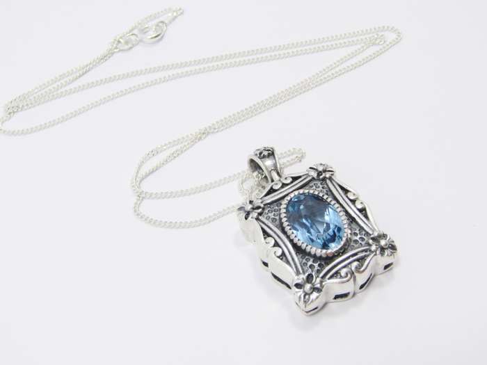 A Spectacular Blue Zirconia  Pendant On Chain in Sterling Silver.