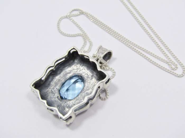 A Spectacular Blue Zirconia  Pendant On Chain in Sterling Silver.