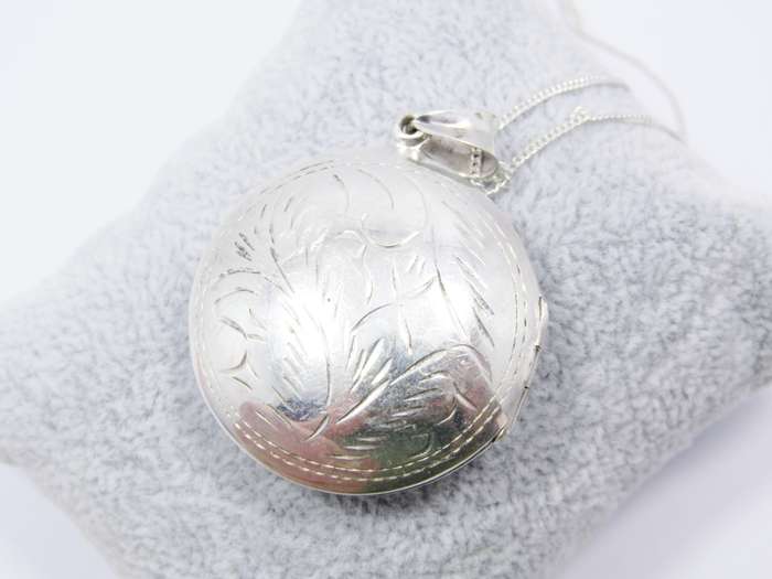 A Gorgeous Domed Vintage Design Locket On Chain in Sterling Silver.
