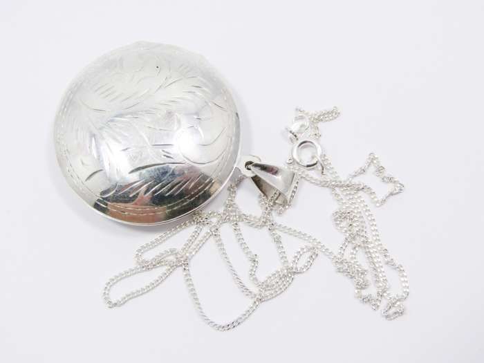 A Gorgeous Domed Vintage Design Locket On Chain in Sterling Silver.