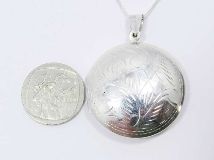 A Gorgeous Domed Vintage Design Locket On Chain in Sterling Silver.