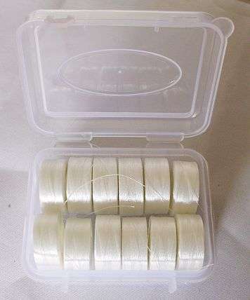 12 x Pre wound bobbins in box