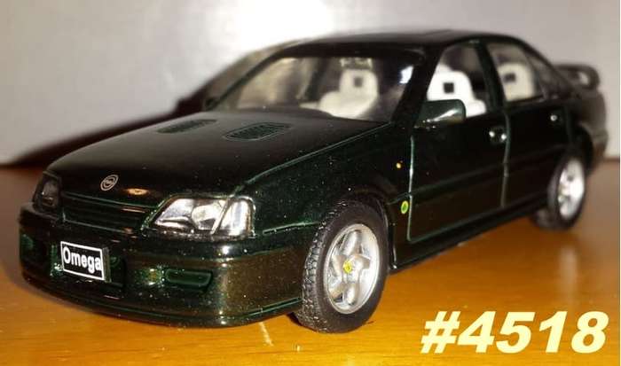 Opel Lotus Omega 1989 black-met 1/43 IXO NEW+showcased  #4518 instant wheels