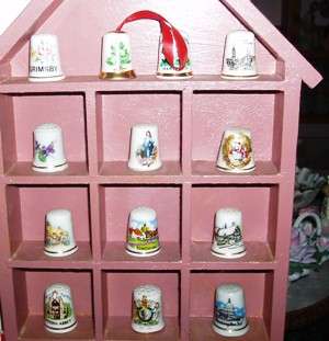 A large collection of  Thimbles And A Cabinet