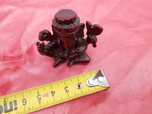 Small, resin figurine of Ganesha, with the elephant`s head.  Known as the remover of obstacles..