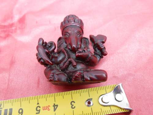 Small, resin figurine of Ganesha, with the elephant`s head.  Known as the remover of obstacles..