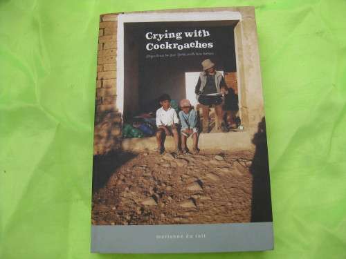 `Crying with Cockroaches`  Argentina to New York with two horses`  Soft cover.