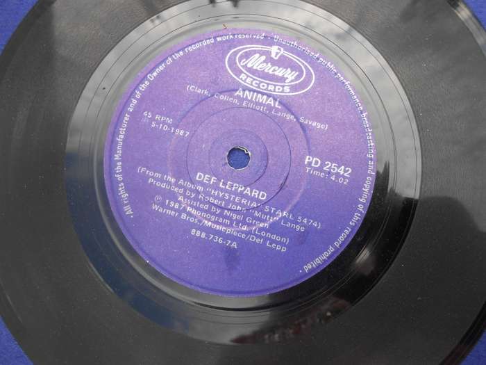 Vinyl 7` single.  Def Leppard.  Tear it down & Animal. VG+ VG+