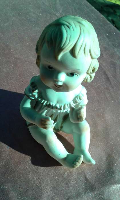 Little girl ornament.  No markings.